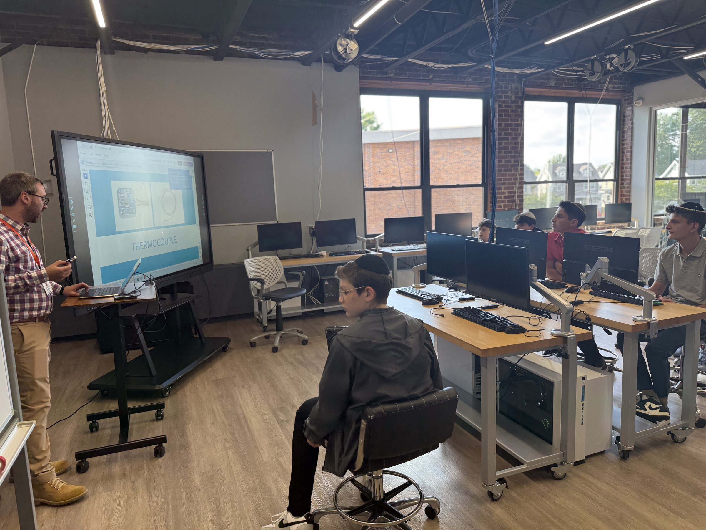 Students learning engineering in the JEC STEM lab